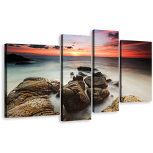 Load image into Gallery viewer, Cloudy Sea Canvas Wall Art, Red Orange Sky Ocean Canvas Print, Brown Ocean Rocks Boulders 4 Piece Canvas
