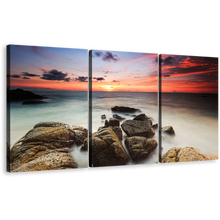 Load image into Gallery viewer, Ocean Boulders Canvas Wall Art, Yellow Red Cloudy Sky Ocean Canvas Set, Brown Ocean Rocks Beach 3 Piece Canvas Print
