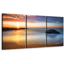 Load image into Gallery viewer, Ocean Rocks Canvas Wall Art, Orange Dawn Sky Streaming Canvas Print, Grey Calm Sea 3 Piece Canvas
