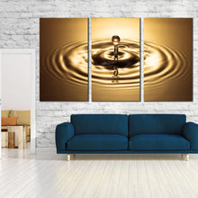 Load image into Gallery viewer, abstract rings canvas print beautiful copper drop splash 3 piece wall art bright gold water droplet triptych canvas set In Living Room
