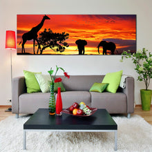 Load image into Gallery viewer, african  silhouette  canvas  print  elephant  giraffe  forest  wildlife  panoramic  canvas  orange  sunset  wall  art  In Living Room
