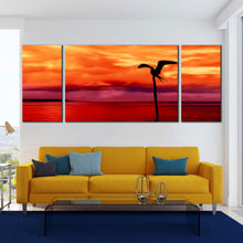 Load image into Gallery viewer, caribbean serenity wall art beautiful orange sky red sea 3 piece multi canvas flying bird silhouette canvas print In Living Room
