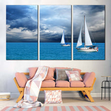 Load image into Gallery viewer, coastal breeze wall art white sailing boats seascape 3 piece set dramatic cloudy blue ocean canvas print In Living Room
