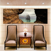 Load image into Gallery viewer, coastal  hideaway  wall  art  sea  cave  under  grey  sky  canvas  artwork  sailing  pirate  boat  ship  1  piece  canvas  print In Living Room
