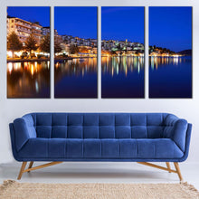 Load image into Gallery viewer, coastal tranquility 4 piece canvas print of boats seascape with yellow greece houses light reflection wall art In Living Room
