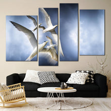 Load image into Gallery viewer, dove flock serenity canvas print graceful flight of white birds multi canvas tranquil blue sky 4 piece wall art In Living Room
