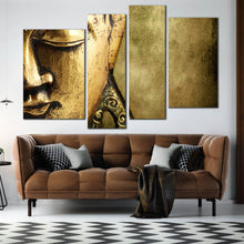 Load image into Gallery viewer, enlightened buddha wall art gold buddha meditation canvas print peaceful buddha close up 4 piece canvas set In Living Room
