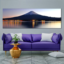 Load image into Gallery viewer, ethereal  mount  fuji  canvas  wall  art  japanese  blue  mountains  lake  panorama  with  nighttime  orange  reflection In Living Room
