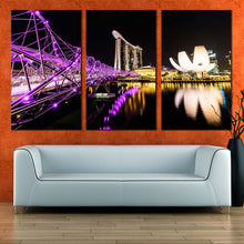 Load image into Gallery viewer, marina bay singapore casino hotel canvas print resort reflection purple helix city bridge 3 piece wall art In Living Room
