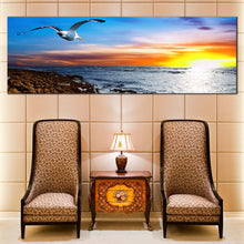 Load image into Gallery viewer, ocean  s  grace  canvas  print  graceful  flight  of  blue  sky  bird  canvas  artwork  captivating  orange  yellow  sunset  wall  art In Living Room
