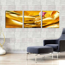 Load image into Gallery viewer, serene  lord  buddha  wall  art  peaceful  yellow  golden  buddha  statue  3  piece  multi  canvas  print In Living Room
