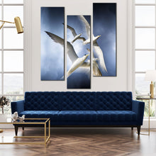 Load image into Gallery viewer, skyward  flight  wall  art  graceful  dove  in  blue  sky  canvas  set  flock  of  white  birds  3  piece  canvas  print In Living Room
