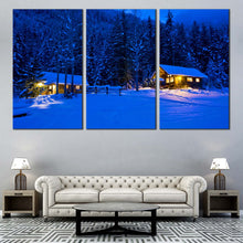 Load image into Gallery viewer, snowy forest serenity canvas blue nighttime trees in 3 panels with yellow cabin lights canvas wall art for your Living Room
