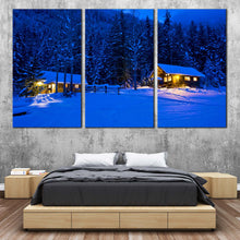 Load image into Gallery viewer, snowy forest serenity canvas print blue nighttime trees in 3 panels with yellow cabin lights canvas wall art for Bedroom
