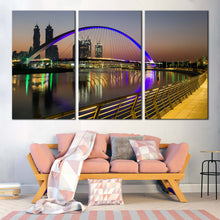 Load image into Gallery viewer, tolerance bridge canvas print iconic 3 piece canvas with blue dubai bridge reflection over grey sky wall art In Living Room
