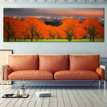 Load image into Gallery viewer, vibrant  orange  trees  landscape  canvas  wall  art  cloudy  grey  sky  panoramic  canvas  print In Living Room
