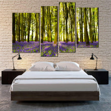 Load image into Gallery viewer, 4 panel canvas home decor Sunlight casts shadows across bluebells in a wood 
