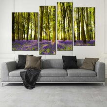 Load image into Gallery viewer, 4 piece artwork of sunbeam through green forest bluebells carpet 
