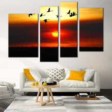 Load image into Gallery viewer, Birds Silhouette Canvas Wall Art Flying Birds in Yellow Sky Canvas Print Beautiful Orange Sunset Bird Flock 4 Piece Multiple Canvas In Living Room
