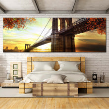 Load image into Gallery viewer, Brooklyn Bridge Canvas Wall Art, Beautiful Dramatic Sunset Yellow Sky Panoramic Canvas, Brown New York Brooklyn Bridge Canvas Print In Bedroom
