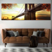 Load image into Gallery viewer, Brooklyn Bridge Canvas Wall Art, Beautiful Dramatic Sunset Yellow Sky Panoramic Canvas, Brown New York Brooklyn Bridge Canvas Print In Living Room
