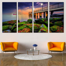 Load image into Gallery viewer, Cloudy Sunset Canvas Wall Art Blue Sky Pier Seascape 4 Piece Multi Canvas Artwork Green Boulders Sea  Canvas Print In Living room
