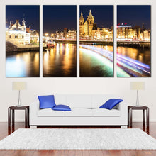 Load image into Gallery viewer, Damrak Canals Canvas Print Yellow Harbors City Lights Reflection Canvas Set Blue Sky Amsterdam Centraal  4 Piece Canvas Wall Art In Living Room
