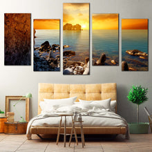 Load image into Gallery viewer, Dramatic Sunset Canvas Wall Art Blue Sea Ocean Rocks Boulders Multi Canvas Yellow Sky Stony Beach  5 Piece Canvas Print For Bedroom
