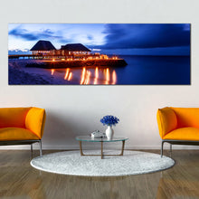 Load image into Gallery viewer, Maldives  Beach  Glowing  Hotel  at  Dusk  Dark  Blue  Sky  Panoramic  canvas  photography In Living Room

