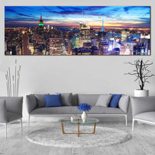 Load image into Gallery viewer, Midtown  Manhattan  Canvas  Wall  Art  Yellow  New  York  City  Lights  Canvas  Set  Blue  Sky  Cityscape  Canvas  Print  NYC  Skyline  Aerial  View  In Living  Room
