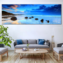 Load image into Gallery viewer, Moeraki  Boulders  in  blue  clear  water  blue  sky  panoramic  artwork  for  living  room
