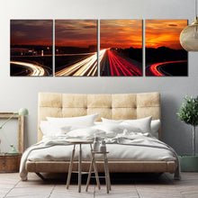 Load image into Gallery viewer, Moving car light trail through twilight city roads 4 piece canvas artwork For Bedroom
