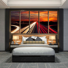 Load image into Gallery viewer, Moving car light trail through twilight city roads 5 panel canvas print In Bedroom
