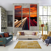 Load image into Gallery viewer, Moving  car  light  trail  through  twilight  city  roads  at  dark  3  panel  wall  decor For Your Living Room
