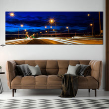 Load image into Gallery viewer, Moving  car  light  trail  through  twilight  city  roads  paronamic  wall  decor In Living Room
