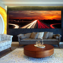 Load image into Gallery viewer, Moving  car  light  trail  through  twilight  city  roads  paronamic  wall  decor In Living Room
