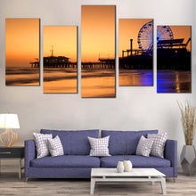 Load image into Gallery viewer, Ocean Beach Canvas Wall Art Orange Beach Pier Sunset Sky Multi Canvas Santa Monika City Pier  5 Piece Canvas Blue Neon lit Ferris Wheel Canvas Print In Living Room
