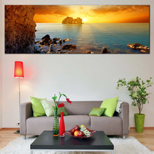 Load image into Gallery viewer, Ocean  Boulders  Canvas  Print  Blue  Sea  Ocean  Rocks  1  Piece  Wide  Canvas  Yellow  Orange  Cloudy  Sunset  Sky  Canvas  Wall  Art In Living Room
