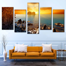 Load image into Gallery viewer, Ocean Boulders Canvas Print Blue Sea Ocean Rocks 5 Piece Multi Panel Canvas Yellow Orange Cloudy Sunset Sky Canvas Wall Art In Living Room
