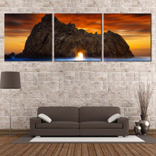 Load image into Gallery viewer, Ocean  Rocks  Canvas  Wall  Art  Burns  State  Park  Keyhole  Rock  Living  Room  3  Piece  Canvas  Print  Yellow  Sunlight  Shining  Through  Rock  Multi  Canvas  Orange  Sunset  Sky In Living Room
