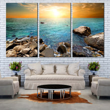 Load image into Gallery viewer, Ocean Rocks Canvas Wall Art Yellow Sunset Sky Canvas Print Blue Stony Beach  3 Piece Multi Canvas IN Living Room
