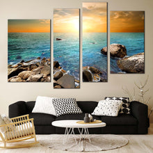 Load image into Gallery viewer, Ocean Rocks Canvas Wall Art Yellow Sunset Sky Canvas Print Blue Stony Beach  4 Piece Multi Canvas 
