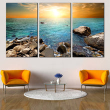 Load image into Gallery viewer, Ocean Sunset Canvas Wall Art Blue Ocean Rocks Canvas Print Blue Stony Beach  3 Piece Canvas Yellow Cloudy Sky Canvas Set For Living Room
