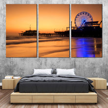 Load image into Gallery viewer, Santa Monica Canvas Wall Art Blue Neon lit Ferris Wheel  3 Piece Canvas Beautiful Ocean Beach Canvas Set Orange Beach Pier Sunset Sky Canvas Print In Bedroom
