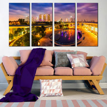 Load image into Gallery viewer, Singapore City Skyline At Night 4 panel canvas print In Living room
