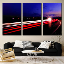 Load image into Gallery viewer, Triptych Traffic Light Trails at Night Abstract In Living Room
