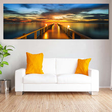 Load image into Gallery viewer, Wooden  Bridge  Canvas  Wall  Art  Dramatic  Blue  Yellow  Sunset  Sky  Canvas  Artwork  Orange  Pier  at  Sea 1  Piece  Canvas  Print In Living Room
