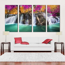 Load image into Gallery viewer, a autumn forest canvas wall art blue waterfall in nature 4 piece canvas print orange red trees waterfall scenic canvas set In Living Room
