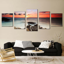 Load image into Gallery viewer, beautiful ocean canvas print brown ocean rocks 5 piece canvas wall art red yellow cloudy sky seascape multi canvas In Living room
