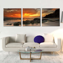 Load image into Gallery viewer, boulders  seascape  canvas  wall  art  orange  cloudy  sky  canvas  print  yellow  ocean  rocks  beach  3  piece  canvas  set In Living Room
